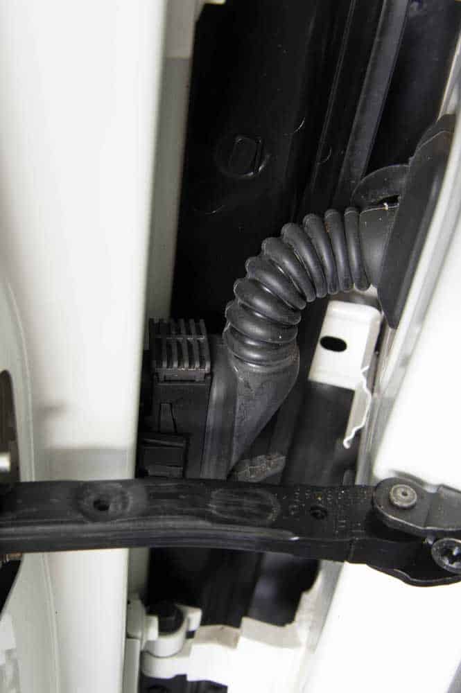 A car door wiring harness grommet
