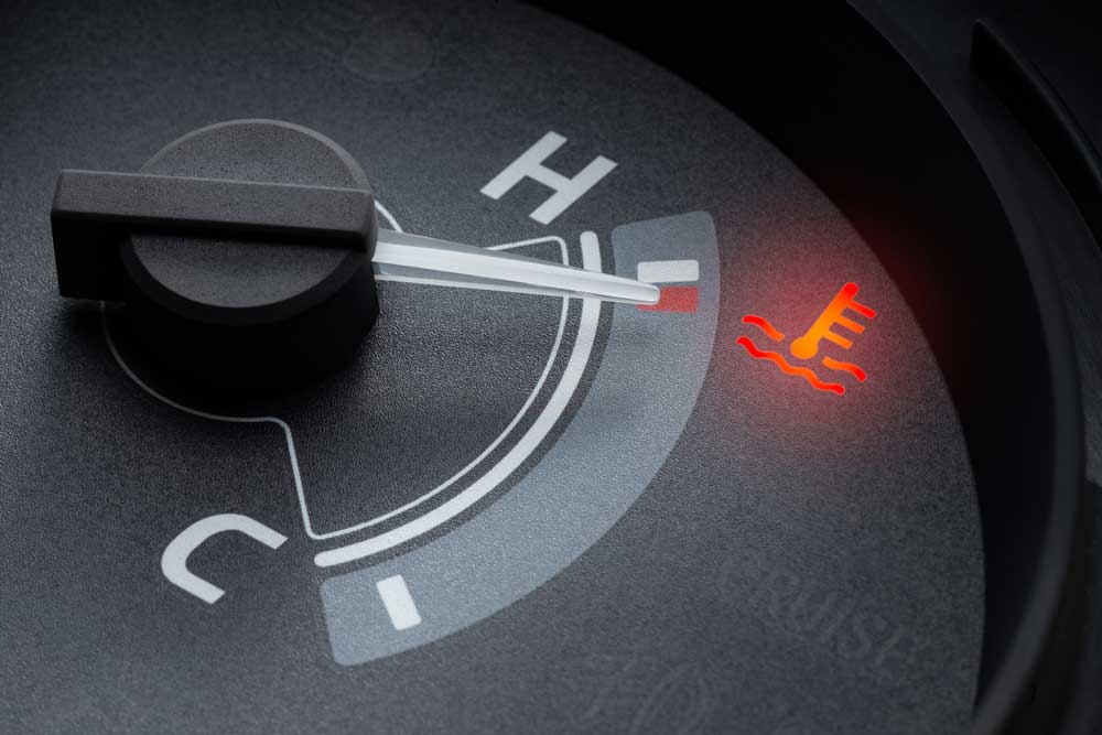 A needle pointer temperature gauge.