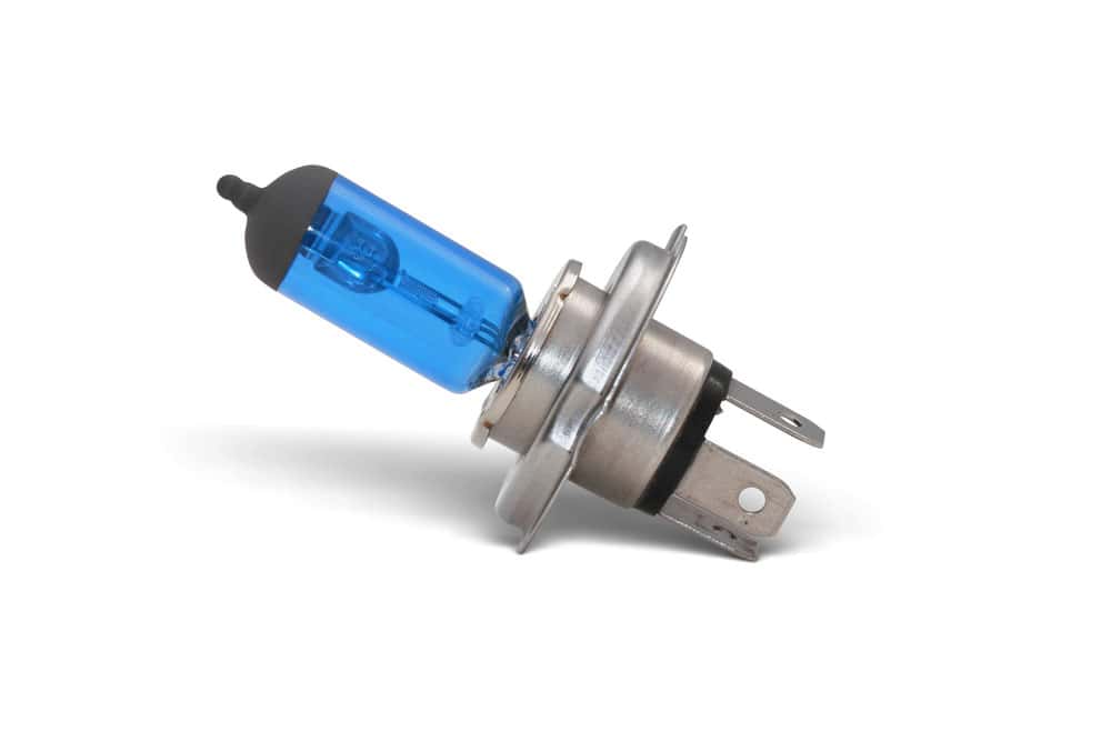 An automotive test light with a pointy probe on one end and a crocodile clip on the other side
