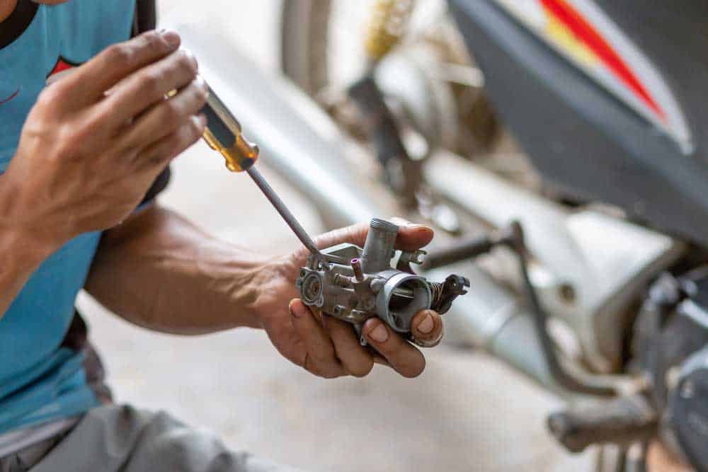 A motorcycle engine carburetor