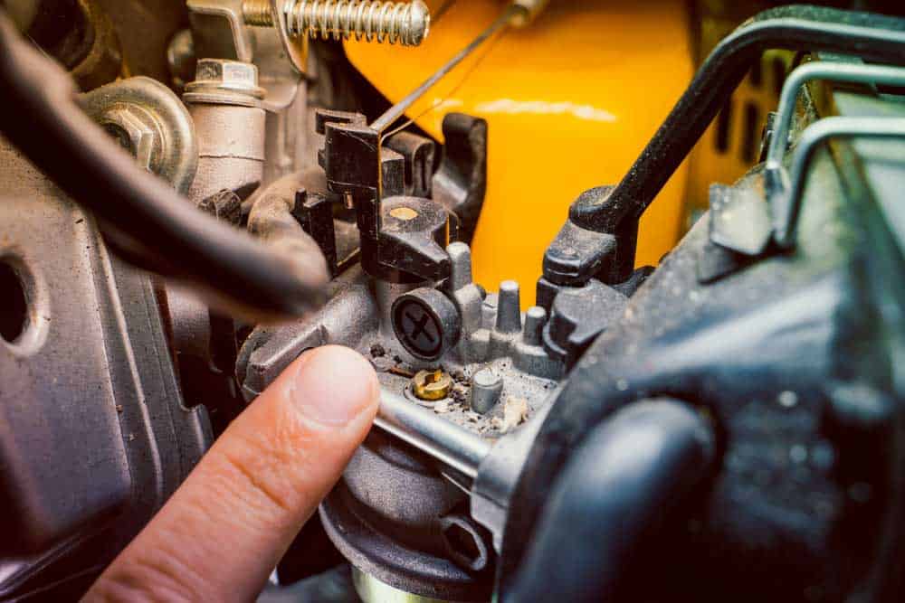 The adjusting screw on a carburetor in a gas generator