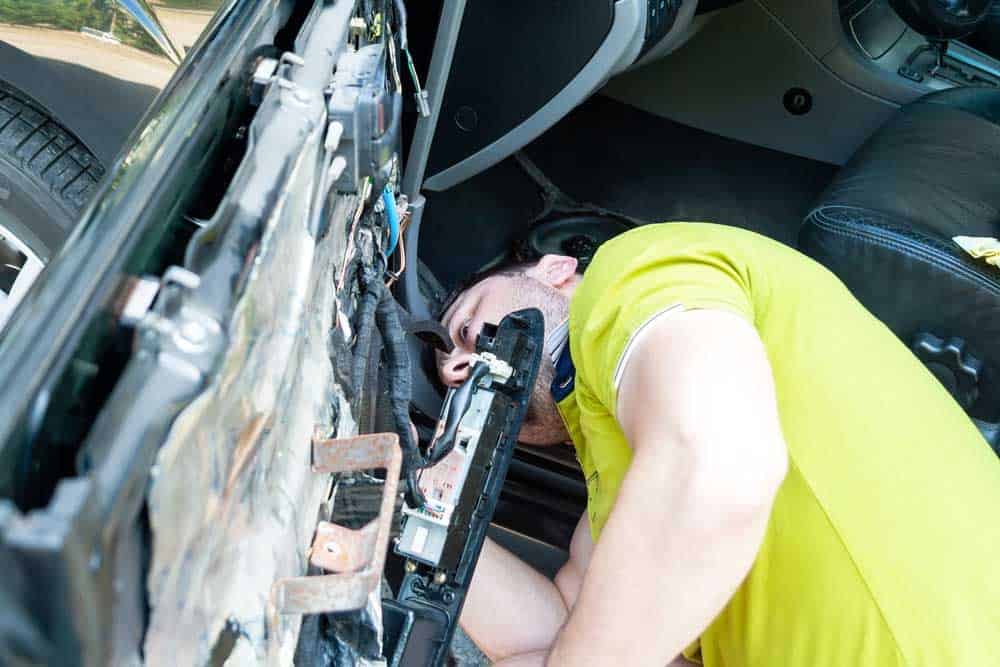 A technician trying to find power window wire harnesses for repairs
