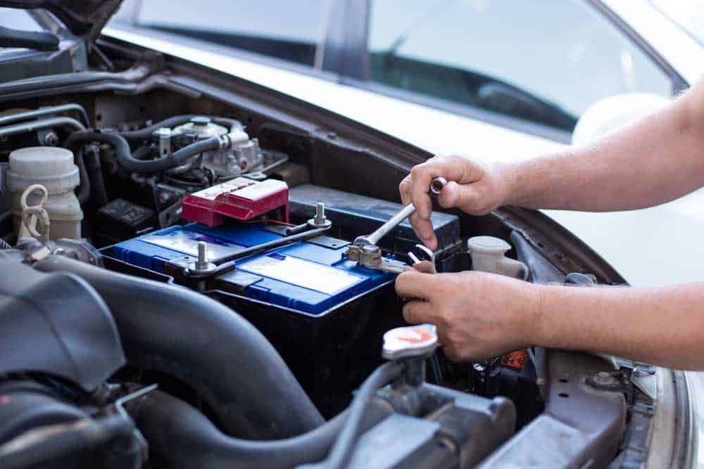 Fixing the car battery. 