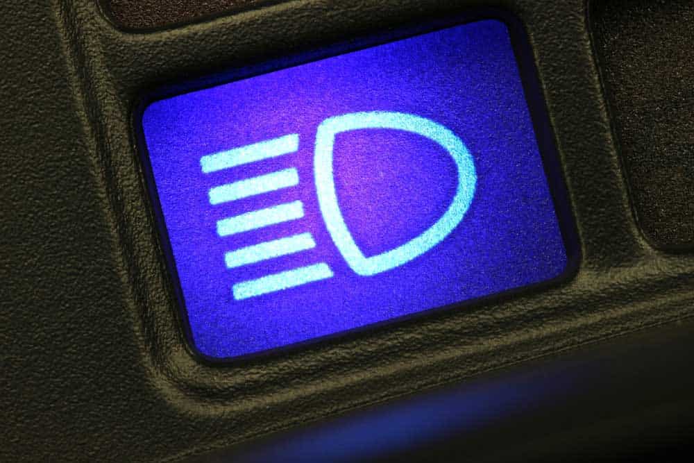A full-beam dashboard light indicator (it usually glows in blue in most cars)