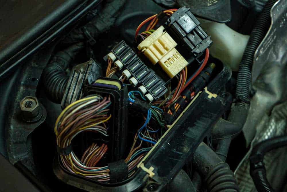 A modern car’s ECU with its electrical cabling
