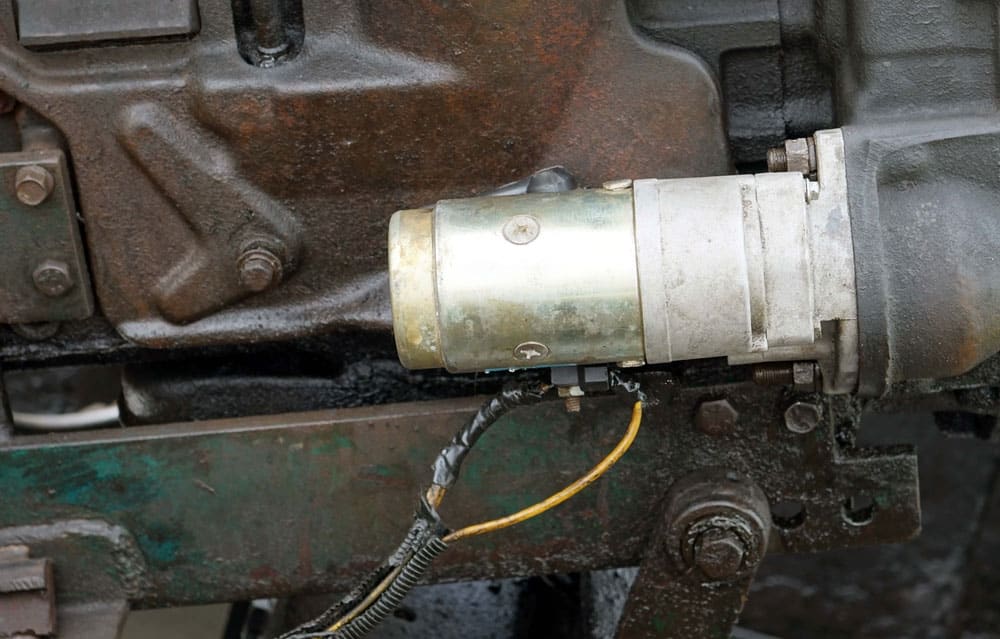 A starter motor in a vintage engine