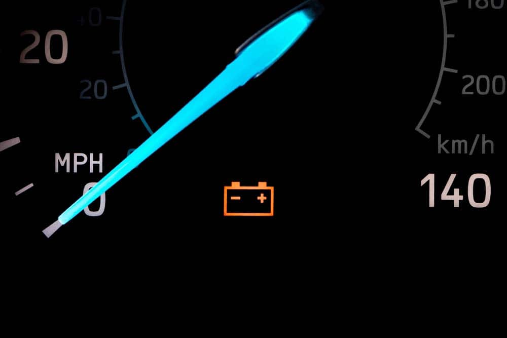An illuminated car battery warning light